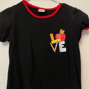 This is a T-shirt that that says the word love on it